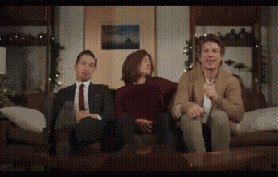 Woman Sitting At Table With Real Housewives Sign GIF