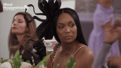Woman Sitting At Table With Tea Real Housewives GIF