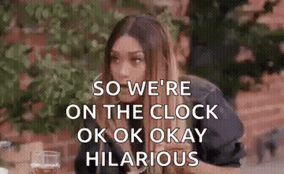 Woman Sitting At Table With Whiskey And Wine GIF