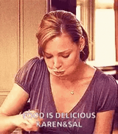 Woman Sitting At Table With Wine GIF