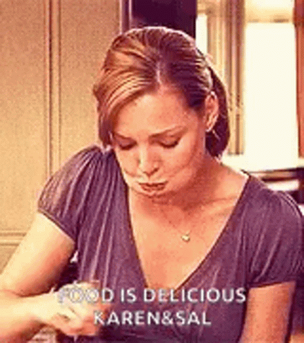 Woman Sitting At Table With Wine GIF