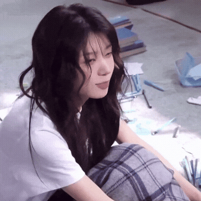 Woman Sitting Cross-Legged With Tongue Out GIF