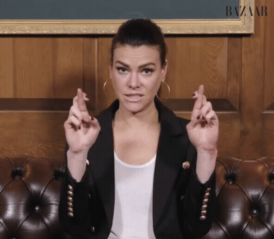 Woman Sitting Crossed Fingers GIF
