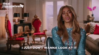 Woman Sitting Eyes Closed Saying I Just Don't Wanna Look At It GIF