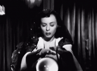 Woman Sitting Holding Crystal Ball GIF