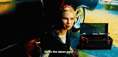 Woman Sitting In Back Of Car With Trunk Open Talking GIF