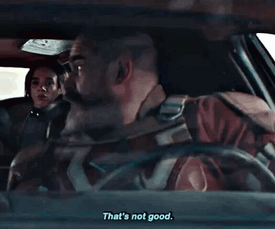 Woman Sitting in Back Seat of Car Talking