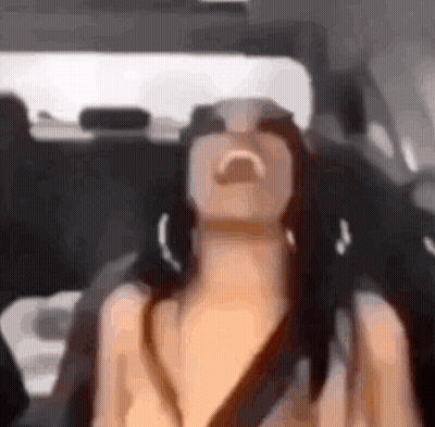 Woman Sitting In Back Seat Of Car With Eyes Closed GIF