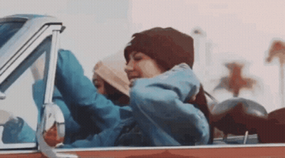 Woman Sitting In Back Seat With Arms Outstretched GIF