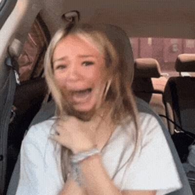 Woman Sitting In Back Seat With Mouth Open GIF