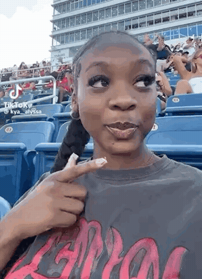 Woman Sitting In Baseball Stadium Stands GIF