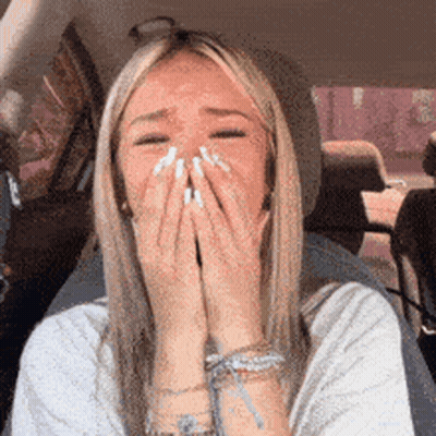 Woman Sitting In Car Covering Face GIF