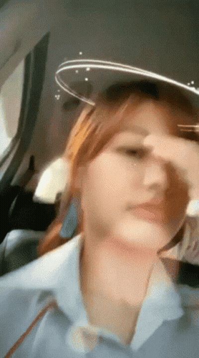 Woman Sitting In Car Covering Nose GIF