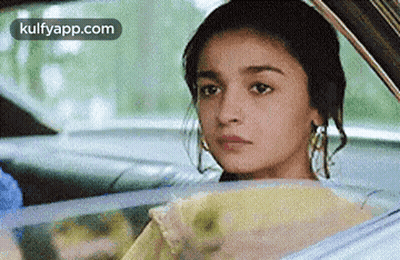 Woman Sitting In Car Looking Out Window GIF