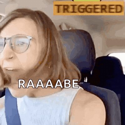 Woman Sitting In Car With Triggered Sign GIF