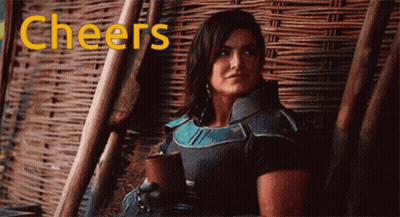 Woman Sitting In Chair Cheers GIF