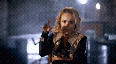 Woman Sitting In Chair Funny Face With Finger GIF