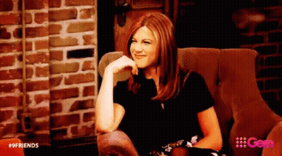 Woman Sitting In Chair Hand On Chin Brick Wall Background GIF