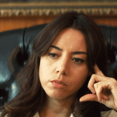 Woman Sitting In Chair Hand On Face GIF