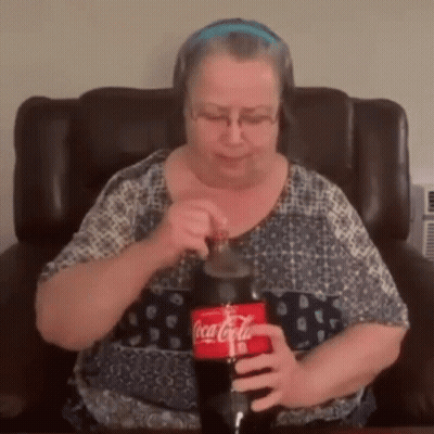 Woman Sitting In Chair Holding Coca-Cola GIF