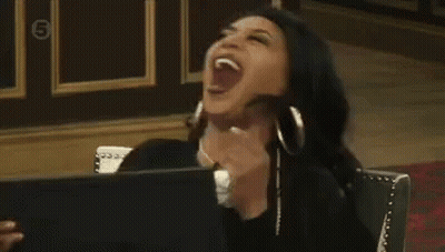 Woman Sitting In Chair Laughing GIF