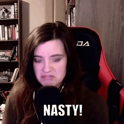 Woman Sitting In Chair Making Funny Face GIF