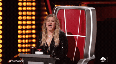 Woman Sitting In Chair Mouth Open NBC Logo GIF