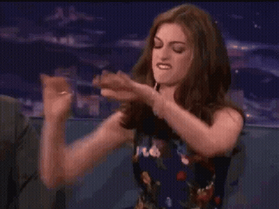 Woman Sitting In Chair Pointing GIF