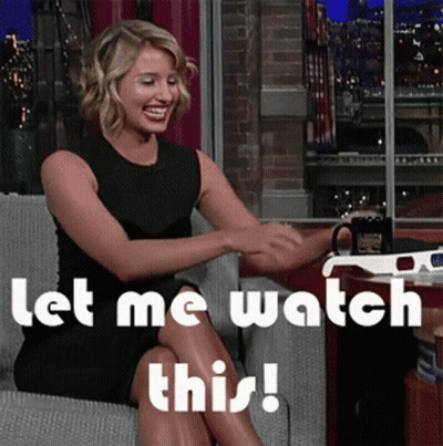 Woman Sitting In Chair Saying Let Me Watch This GIF
