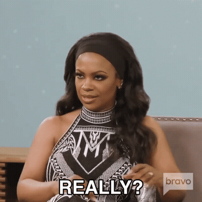 Woman Sitting In Chair Saying Really GIF