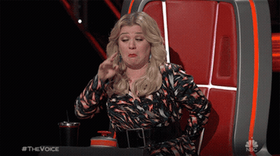 Woman Sitting In Chair Saying The Voice GIF