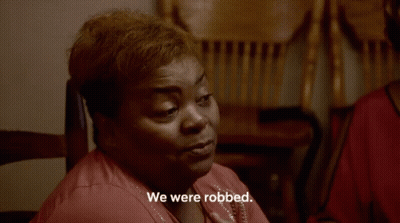Woman Sitting In Chair We Were Robbed GIF