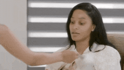 Woman Sitting In Chair While Man Holds Her Shirt GIF
