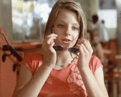 Woman Sitting In Chair With Bet Logo GIF