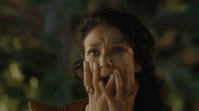Woman Sitting In Chair With Hands On Face GIF
