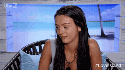 Woman Sitting In Chair With Love Island GIF