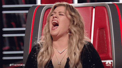 Woman Sitting In Chair With Mouth Open GIF