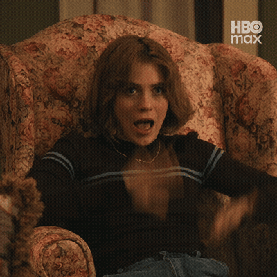Woman Sitting In Chair With Mouth Open GIF