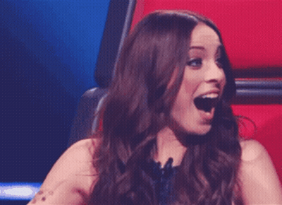 Woman Sitting In Chair With Mouth Wide Open GIF