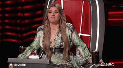 Woman Sitting In Chair With NBC Logo GIF