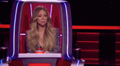Woman Sitting In Chair With NBC Logo GIF