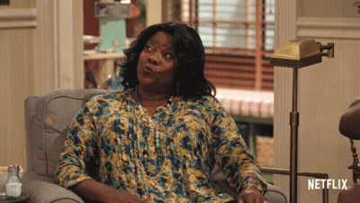 Woman Sitting In Chair With Netflix Logo GIF