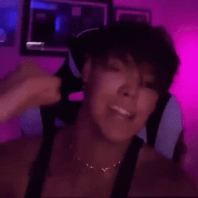 Woman Sitting In Chair With Pink Wall GIF