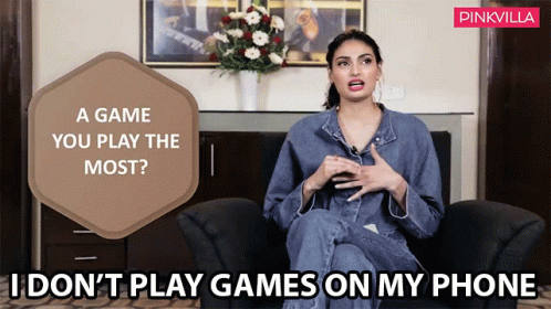 Woman Sitting In Chair With Pinkvilla Logo GIF