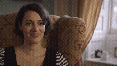 Woman Sitting In Chair With Striped Shirt GIF