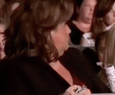 Woman Sitting In Crowd GIF