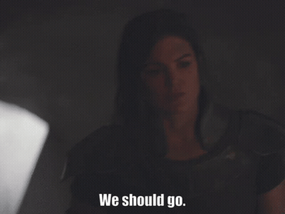 Woman Sitting In Dark Room Saying We Should Go GIF