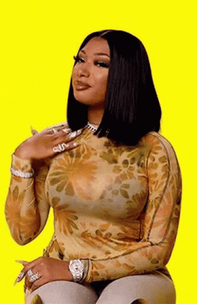 Woman Sitting In Floral Top And Watch GIF