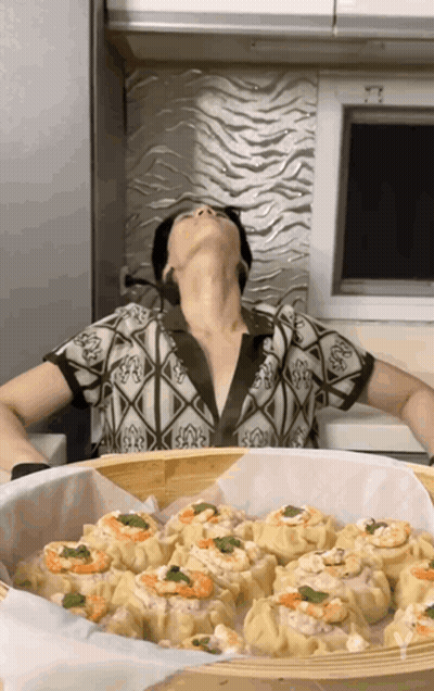 Woman Sitting In Front Of Basket Of Food GIF