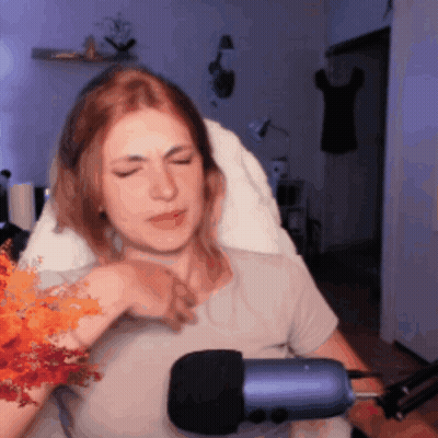 Woman Sitting In Front Of Blue Microphone GIF